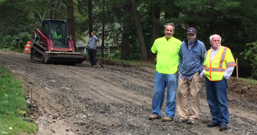 Road Commissioner Sam Vergata, Ray Barrett, Field Inspector, and Kevin Mansfield, Chief Inspector (both from Village Engineers Sidney B. Bowne) reviewing Friendly Road conditions on September 29th. Rain may delay completion of the road for a few days. It is essential for the roadbed to be dry and stable before asphalt is laid on top.